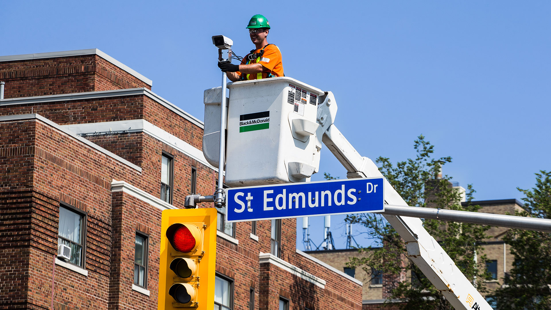B&M service technician installing intelligent traffic management system at an intersection