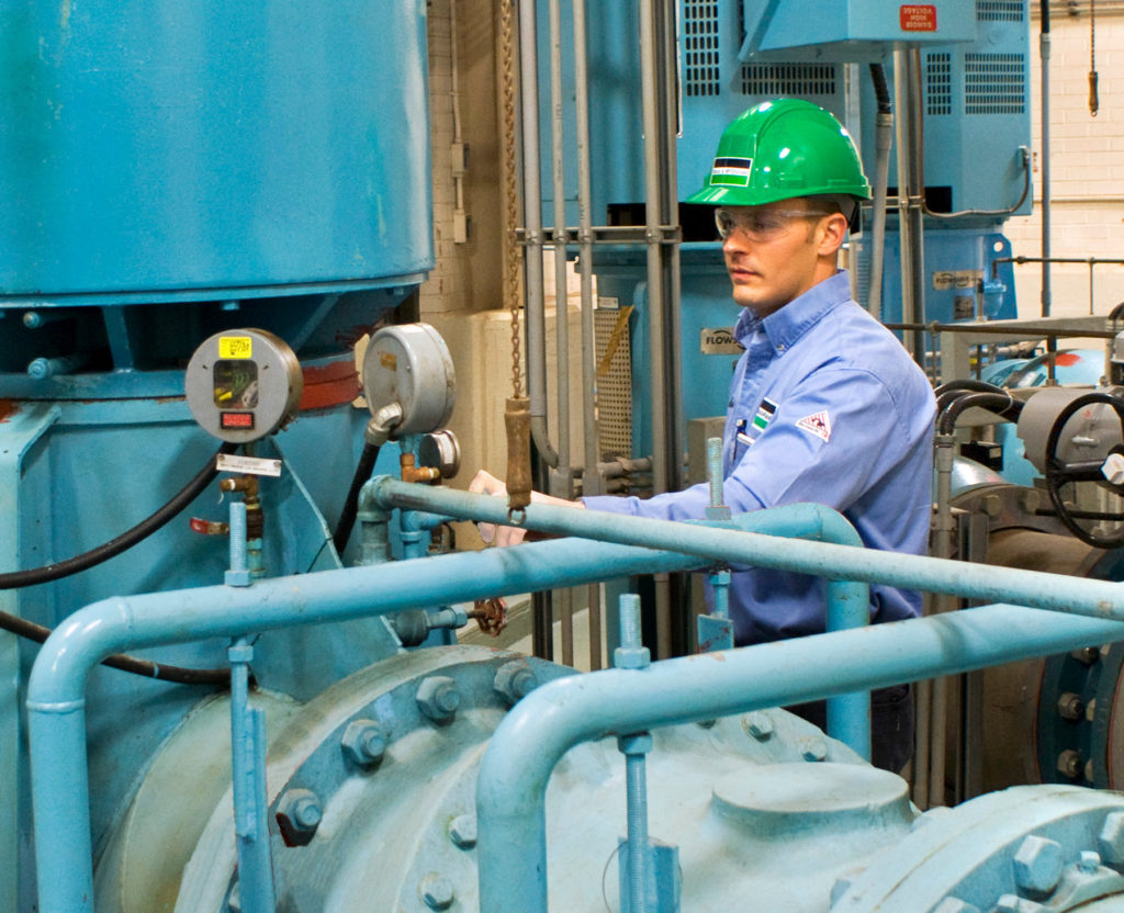 B&M service technician servicing a plumbing system.