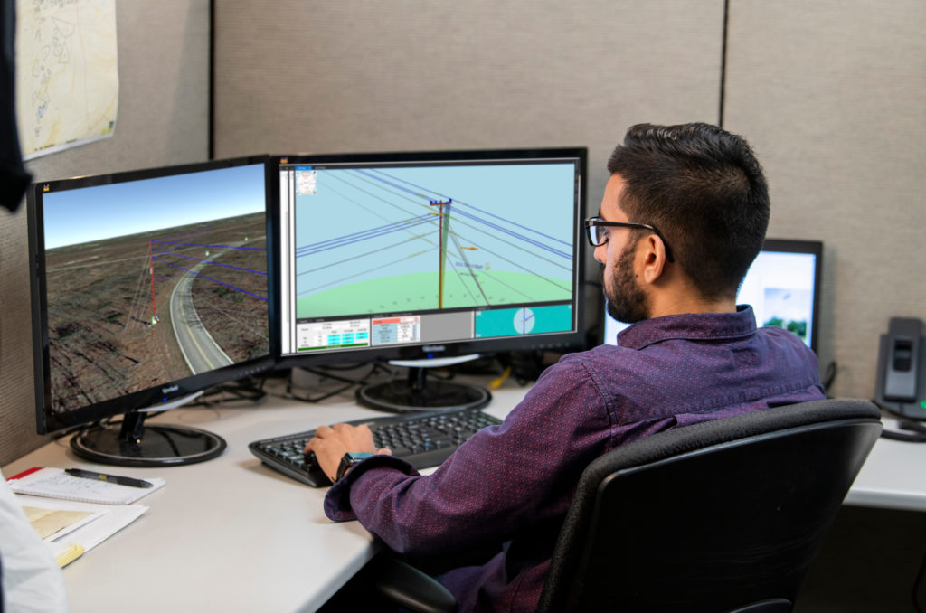 B&M's in-house engineering designs professional working on a utility overhead design project in AutoCAD