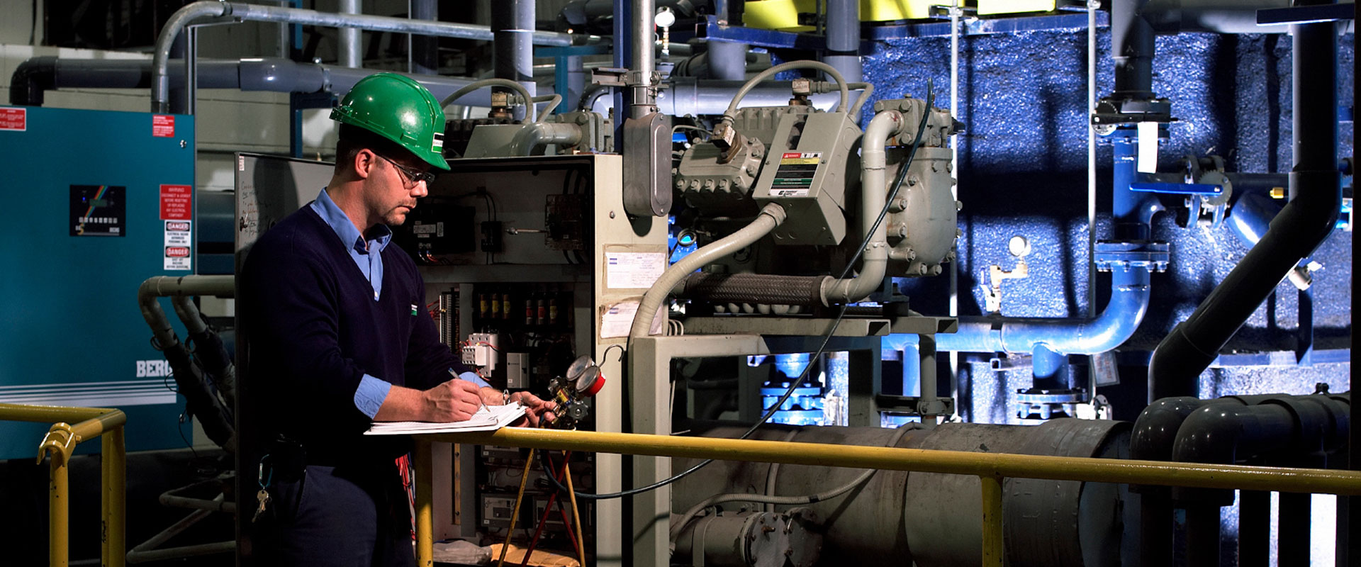 B&M service technician conducting inspections at an industrial facility's refrigeration and production cooling system.