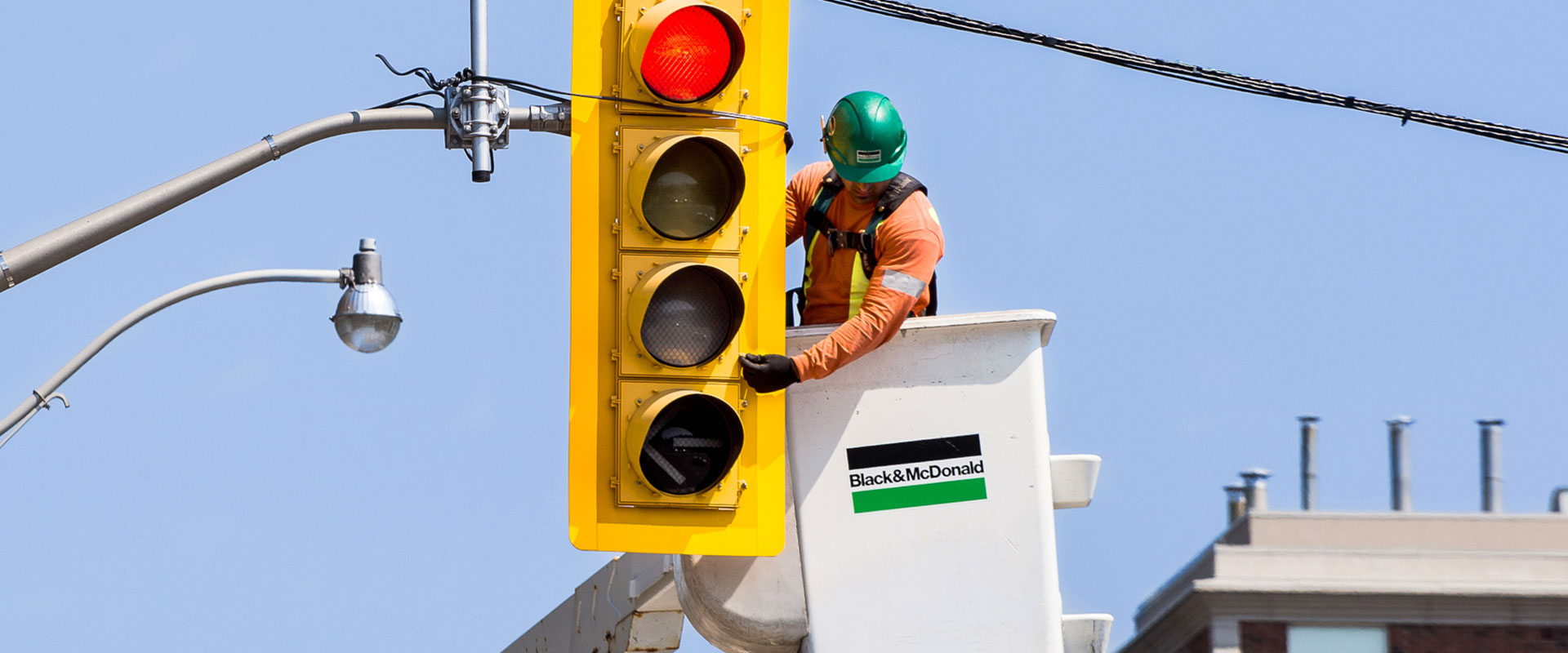 B&M's tradesperson installing an intelligent traffic signal