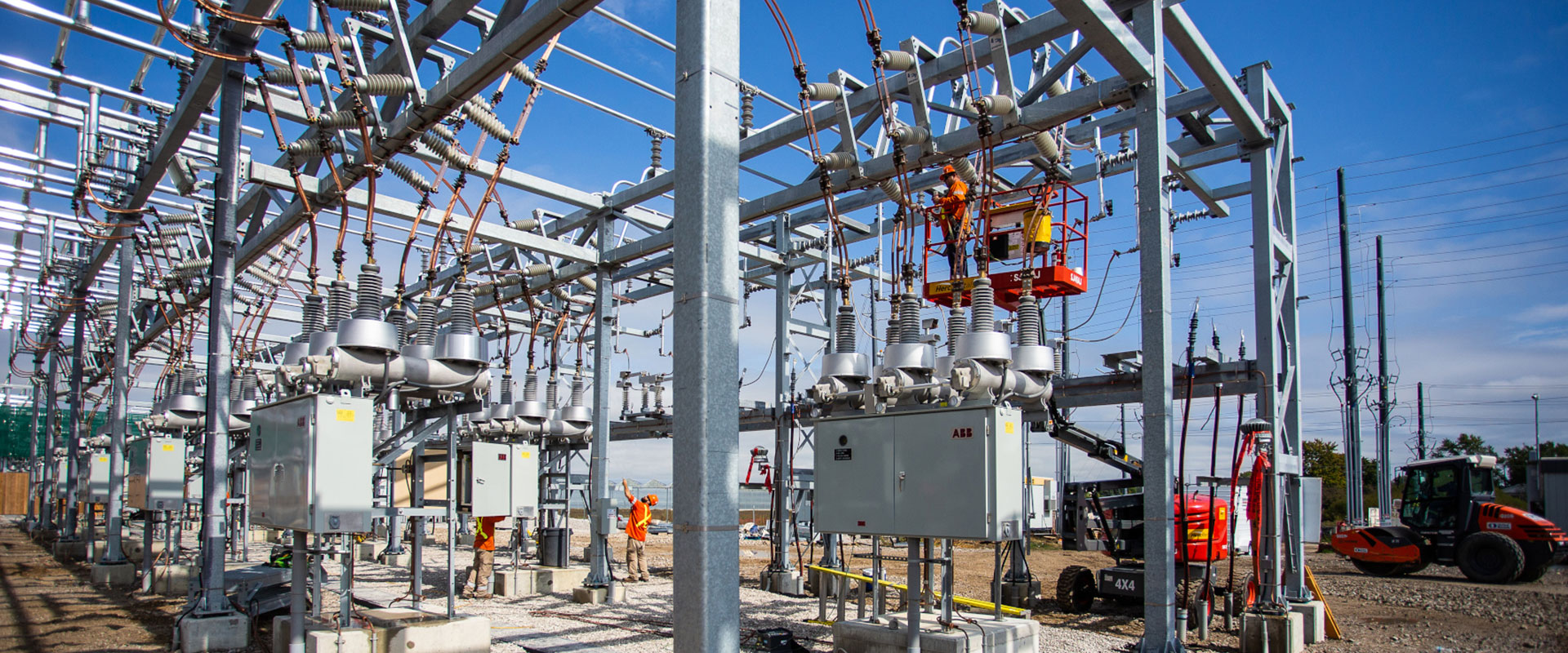 A team of B&M electrical tradesperson working on a construction of a high voltage substation