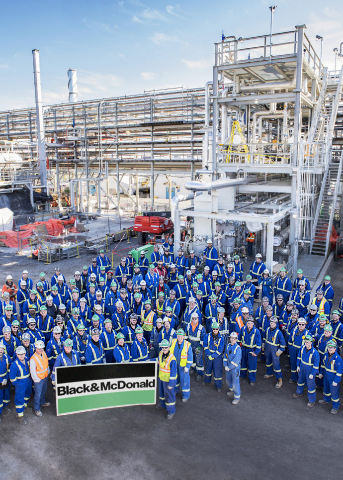 A group of B&M employees celebrating project completion